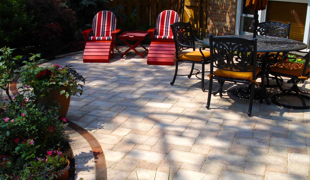 Brussels block tumbled concrete paver patio by Unilock with clay paver