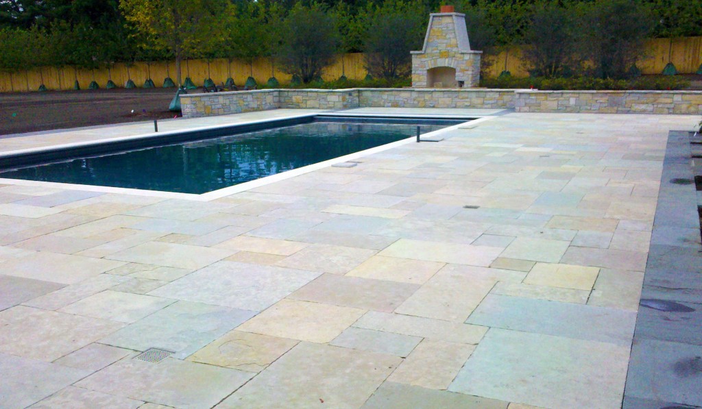 Kato stone pool deck with bluestone banding and Valders coping - Hirsch